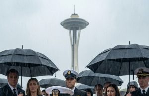 My brother-in-law tried to kick my dog out of the rain-soaked funeral—until a senior admiral knelt in the mud and revealed a secret that silenced everyone.