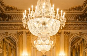 Standing amidst the wealthy elite, a billionaire watched in absolute silence as a Black waitress approached his disabled son and asked him to dance. The crowd gasped at her audacity—but what happened next shook the entire ballroom to its core.
