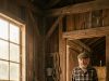 I was working on the edge of my property when I spotted a barefoot 7-year-old slipping through the tall grass behind my ranch. Driven by a sudden bad feeling, I followed him to an abandoned shed—and what I found inside changed my life forever.